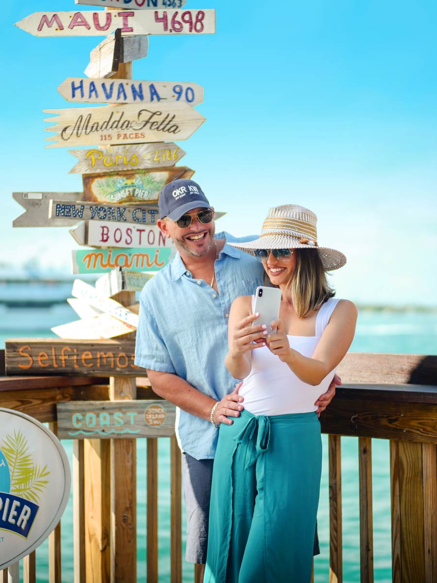 Couple Taking A Selfie On The Sunset Pier.